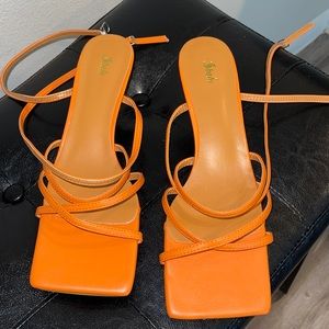 Orange kitten heel sandals with strap that buckles around ankle!